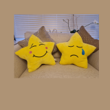 image of arge star cushion. Happy emotion on one side and sad on the other,